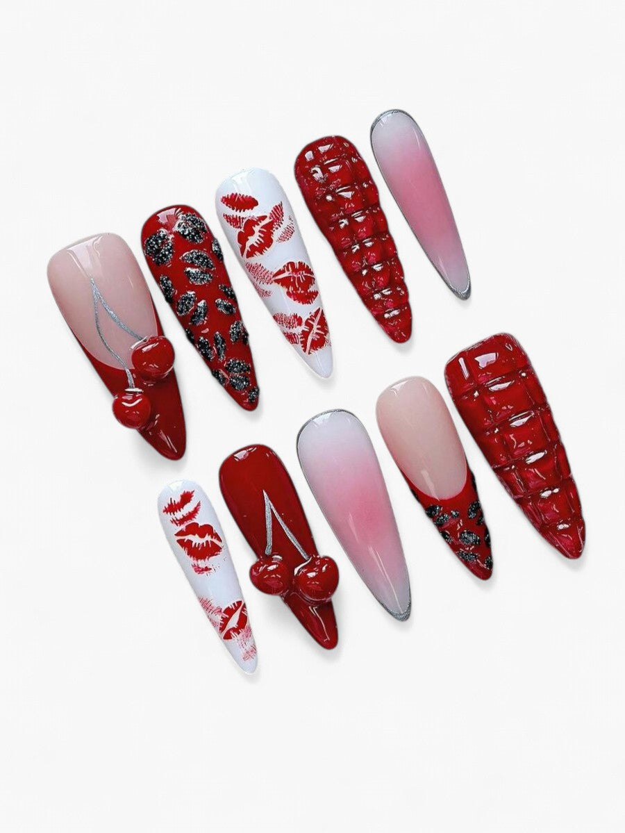 Ensemble de 10 faux ongles Cherry Rouge en forme d'amande avec dégradé rose, motifs lèvres, cerises 3D et cristaux.