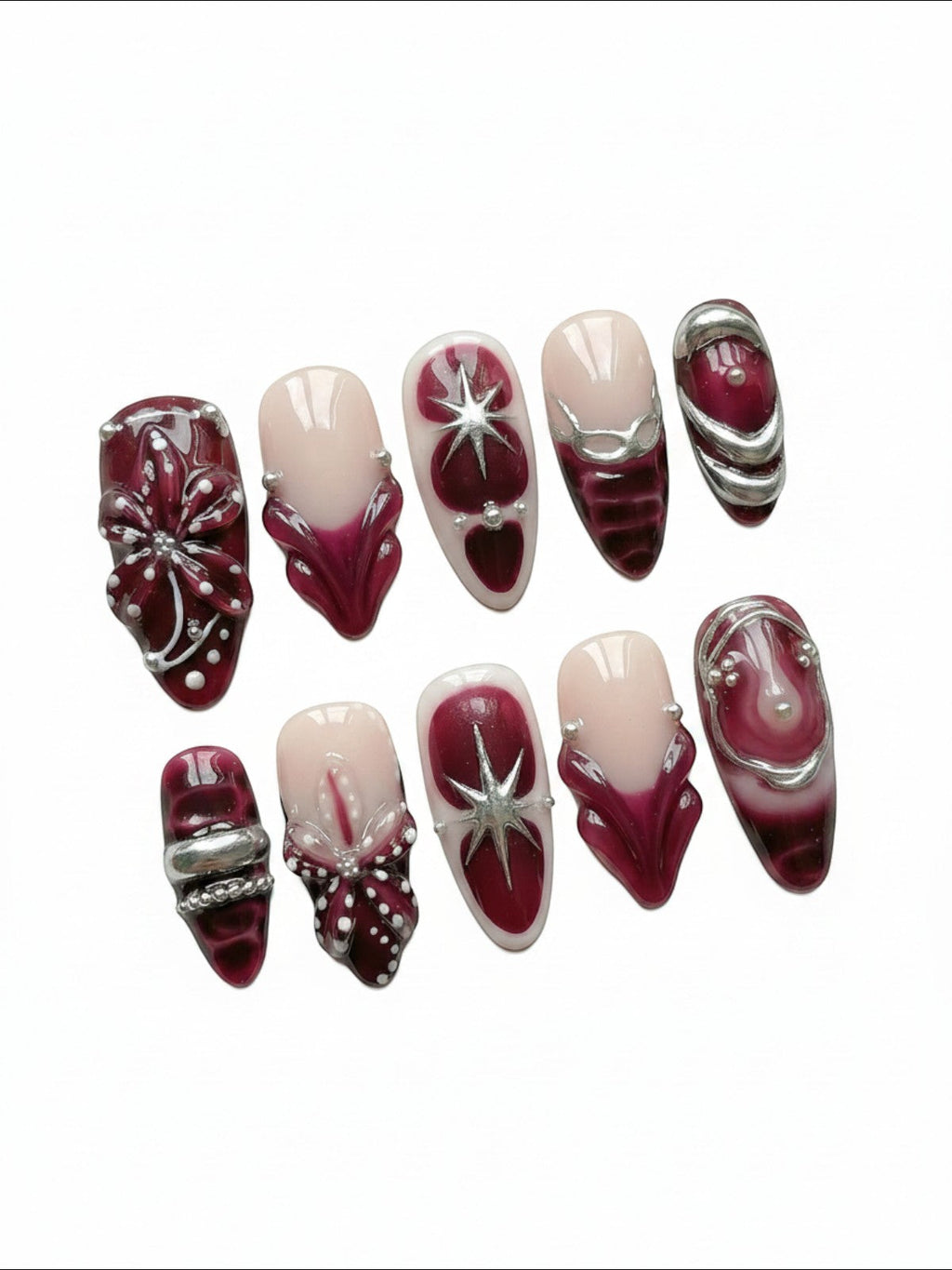 Set de faux ongles Cherry Rouge Dewdrop Romance bordeaux et nude avec motifs étoiles argentées et détails en relief