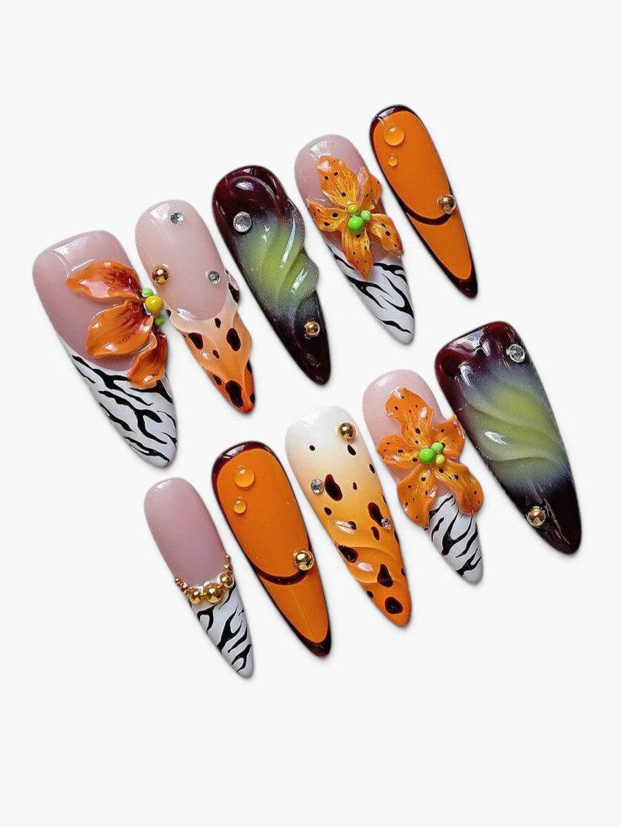 Faux ongles Cherry Rouge multicolores en amande avec fleurs en relief, motifs zébrés et finitions brillantes