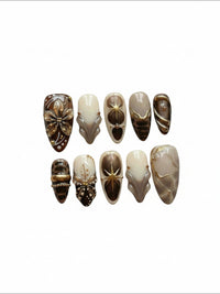 Set de faux ongles Cherry Rouge Dewdrop Romance avec motifs floraux, étoiles dorées et détails en relief marron