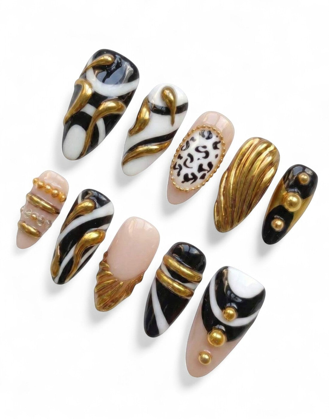 Set de 10 faux ongles Cherry Rouge en forme amande avec motifs abstraits, animaliers et ornements dorés 3D en relief.
